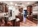 Spacious kitchen with island, stainless steel appliances, and hardwood floors at 5465 S State Road 75, Jamestown, IN 46147