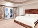 Main bedroom with sliding barn doors and a rustic wooden bed frame at 5465 S State Road 75, Jamestown, IN 46147