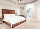Main bedroom with a rustic wooden bed frame and an ensuite bathroom at 5465 S State Road 75, Jamestown, IN 46147