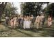 Wedding party walking in a lush green field at 5465 S State Road 75, Jamestown, IN 46147