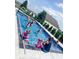 People playing volleyball in a refreshing blue in-ground pool at 5465 S State Road 75, Jamestown, IN 46147