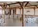 Rustic reception hall with string lights and wooden beams at 5465 S State Road 75, Jamestown, IN 46147