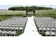 Outdoor wedding ceremony setup with white chairs and aisle runner at 5465 S State Road 75, Jamestown, IN 46147