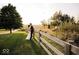 Bride and groom embracing near a wooden fence at 5465 S State Road 75, Jamestown, IN 46147