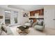 Finished basement with outdoor access, built-in wet bar, and seating area at 588 E Vermont St, Indianapolis, IN 46202