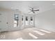 Spacious bedroom with large windows and ceiling fan at 588 E Vermont St, Indianapolis, IN 46202