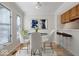 Bright breakfast nook with hardwood floors, counter seating, and modern decor at 588 E Vermont St, Indianapolis, IN 46202