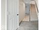 Front entry with tile floor and staircase to upper level at 588 E Vermont St, Indianapolis, IN 46202