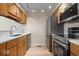 Modern kitchen with stainless steel appliances and light wood cabinets at 588 E Vermont St, Indianapolis, IN 46202