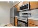 Stainless steel appliances in galley style kitchen at 588 E Vermont St, Indianapolis, IN 46202