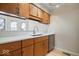 Kitchen with wood cabinets and quartz countertops at 588 E Vermont St, Indianapolis, IN 46202