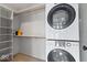 Convenient laundry room with washer, dryer, and shelving at 588 E Vermont St, Indianapolis, IN 46202