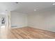 Bright living room with hardwood floors and access to patio at 588 E Vermont St, Indianapolis, IN 46202