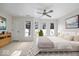 Large primary bedroom with a ceiling fan, bright windows, and neutral tones at 588 E Vermont St, Indianapolis, IN 46202