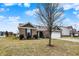 Brick home with landscaping and tree at 7652 Winding Lake N Dr, Noblesville, IN 46062