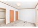 Bright bedroom featuring wood-toned doors and carpeting at 806 Indiana Ave, Alexandria, IN 46001