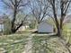 The backyard features a garage and a walkway at 817 N Linwood Ave, Indianapolis, IN 46201
