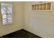 Empty bedroom with two windows, showcasing natural light and potential for renovation and design at 817 N Linwood Ave, Indianapolis, IN 46201