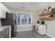 Bright kitchen with stainless steel appliances, granite countertops and bay window seating at 8198 Wade Hill Ct, Indianapolis, IN 46256