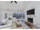 Cozy living room with a fireplace, vaulted ceilings, and a comfortable sectional sofa at 8198 Wade Hill Ct, Indianapolis, IN 46256