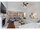 Open-concept living area features a fireplace, hardwood floors, and flows into the dining area for easy entertaining at 8198 Wade Hill Ct, Indianapolis, IN 46256