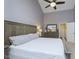 Spacious main bedroom features a ceiling fan and an adjoining door to an ensuite bathroom at 8198 Wade Hill Ct, Indianapolis, IN 46256