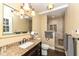Updated bathroom with granite vanity, large mirror, and walk-in shower at 8365 N Pennsylvania St, Indianapolis, IN 46240