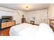 Bedroom with hardwood floors, built-in shelving and a dresser at 8365 N Pennsylvania St, Indianapolis, IN 46240