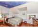 Bedroom with a night sky ceiling and built-in shelving at 8365 N Pennsylvania St, Indianapolis, IN 46240
