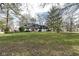 Spacious front yard with mature trees and a view of the house at 8365 N Pennsylvania St, Indianapolis, IN 46240