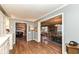 View down a hallway showing access to the kitchen, dining room, and living room at 8365 N Pennsylvania St, Indianapolis, IN 46240