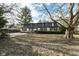Exterior view of house with large backyard and mature trees at 8365 N Pennsylvania St, Indianapolis, IN 46240