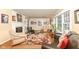 Spacious living room with hardwood floors, fireplace and comfortable seating at 8365 N Pennsylvania St, Indianapolis, IN 46240
