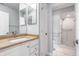 Bathroom with granite countertop, white vanity, and walk-in shower at 8650 Jaffa Ct W Dr # 12, Indianapolis, IN 46260