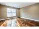 Bright bedroom with hardwood floors and large window at 8650 Jaffa Ct W Dr # 12, Indianapolis, IN 46260