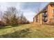 Brick building with balconies and grassy area at 8650 Jaffa Ct W Dr # 12, Indianapolis, IN 46260