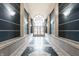 Elegant hallway with marble floors and arched window at 8650 Jaffa Ct W Dr # 12, Indianapolis, IN 46260
