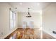 Bright dining room with hardwood floors and large windows at 8650 Jaffa Ct W Dr # 12, Indianapolis, IN 46260