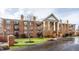 Front view of a brick building with landscaping and parking at 8650 Jaffa Ct W Dr # 12, Indianapolis, IN 46260