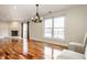Bright living room with hardwood floors, fireplace, and sliding glass doors at 8650 Jaffa Ct W Dr # 12, Indianapolis, IN 46260