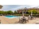 Community pool with patio furniture at 8650 Jaffa Ct W Dr # 12, Indianapolis, IN 46260