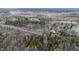 Aerial view of a community nestled amongst the trees and several lakes at 8850 W State Road 46, Columbus, IN 47201