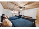 Basement bedroom with wood ceiling, twin beds, and American flag decor at 8850 W State Road 46, Columbus, IN 47201