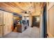Finished basement office with wood ceiling, desk, and two computer monitors at 8850 W State Road 46, Columbus, IN 47201