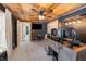 Basement office with wood ceiling, desk, and large monitor setup at 8850 W State Road 46, Columbus, IN 47201