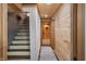 Basement stairs with wood and white risers, leading upstairs at 8850 W State Road 46, Columbus, IN 47201