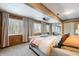 Spacious bedroom with wood walls and large windows offering natural light at 8850 W State Road 46, Columbus, IN 47201