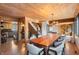 Open concept dining area with a farmhouse table and kitchen views at 8850 W State Road 46, Columbus, IN 47201