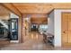 Bright entryway with hardwood floors and views into living and dining areas at 8850 W State Road 46, Columbus, IN 47201