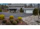 This two-story grey home features an attached garage, and a well-manicured front yard at 8850 W State Road 46, Columbus, IN 47201